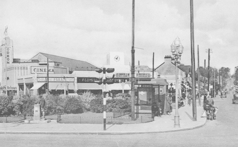 A nostalgic picture of Albert Crescent in South Chingford c1936 showing the Odeon Cinema, ornate street lanterns, a police box, drinking fountain, gardens and WC